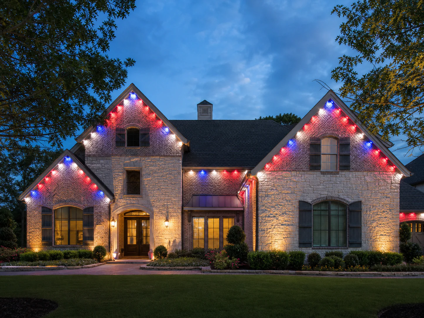 Permanent roofline LEDs displaying a red, white, and blue celebration scene